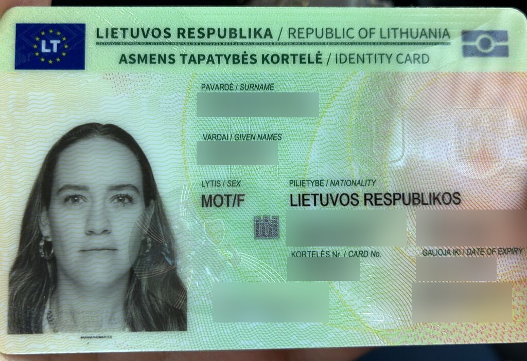 Blurred Lithuanian identity card after successful citizenship restoration